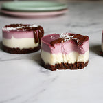 A pair of vegan Vanilla Berry Cheesecakes
